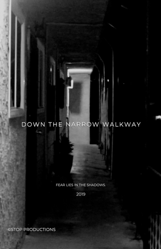 down the narrow walkway framed up film festival